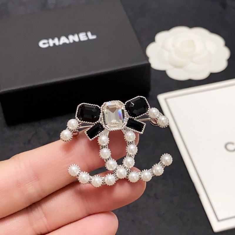 Ch*el brooches